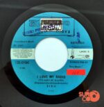 Disco de Vinilo Paul Lekakis - Boom Boom (Let's Go Back To My Room) / I Love My Radio Vinyl Record